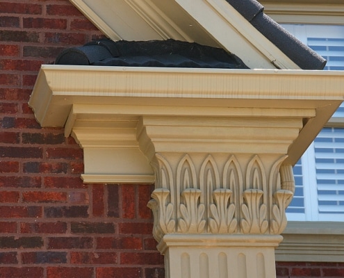 Detailed cornice and flashing repair on residential roof in Georgia