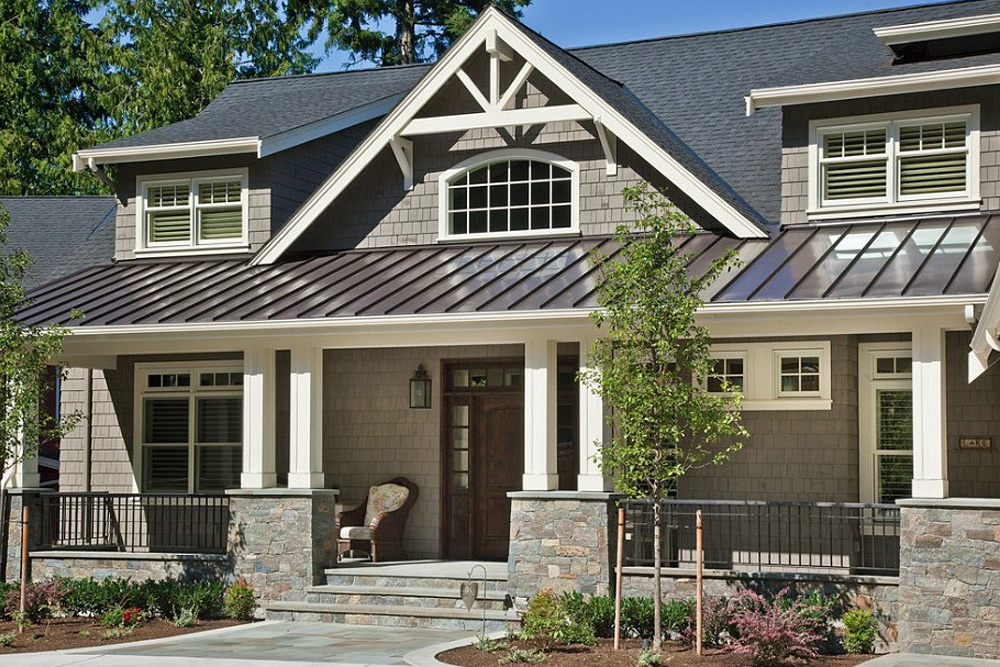 metal-roofing-3 Craftsman-style home featuring black metal roof system