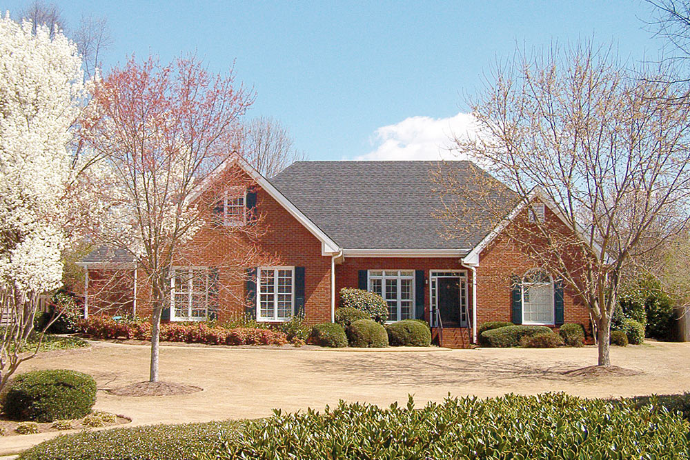 residential-roofing-7 Residential home with natural slate roofing installed by Academy Roofing