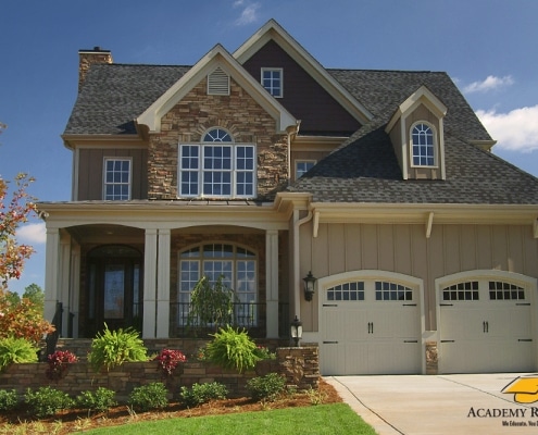 residential-roofing-8 Two-story house with synthetic slate roof and ridge vent in Georgia