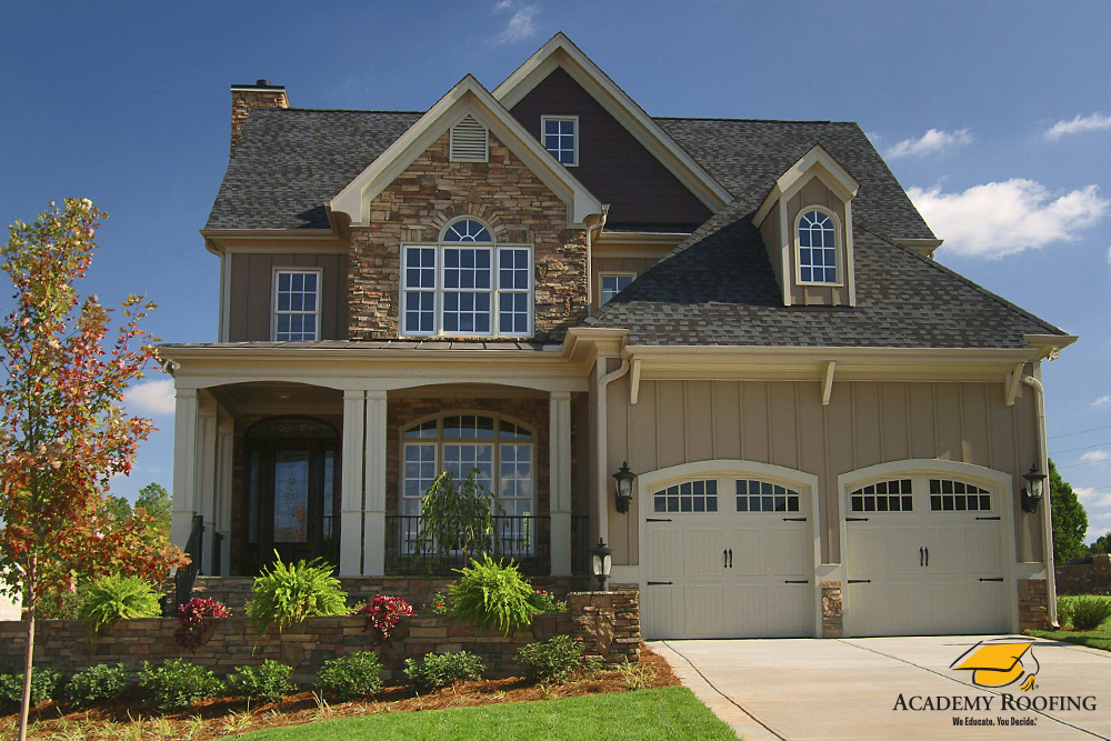 residential-roofing-8 Two-story house with synthetic slate roof and ridge vent in Georgia
