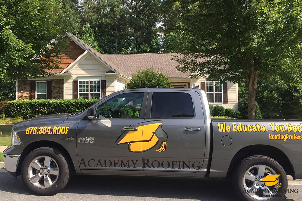 residential-roofing-9 Academy Roofing service truck at a Georgia residential project site