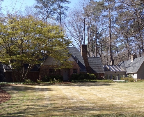Night view of specialty roofing lit up on Georgia residence