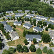 Aerial photo of residential neighborhood in Acworth, GA showing rooftops and surrounding trees