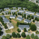Aerial photo of residential neighborhood in Acworth, GA showing rooftops and surrounding trees