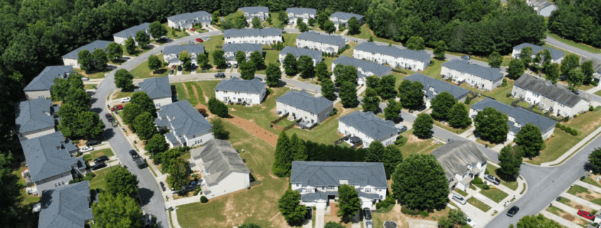 Aerial photo of residential neighborhood in Acworth, GA showing rooftops and surrounding trees