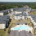 Aerial view of a large apartment complex in Atlanta, GA with well-maintained commercial roofing and a swimming pool