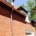 Copper gutter system installed on red brick home in Atlanta – Academy Roofing