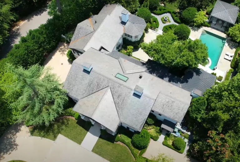 Aerial image of a residential roofing project in Atlanta showing the roof over a pool area, executed by Academy Roofing