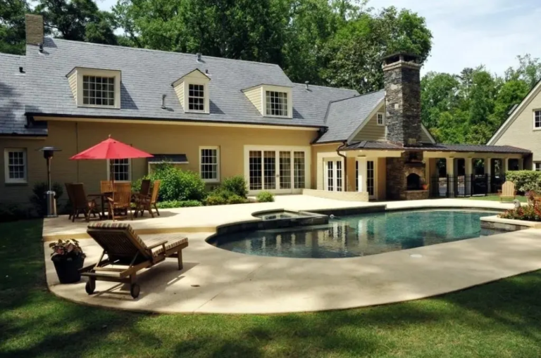 New roof installation on a luxury Atlanta home with pool and patio, completed by Academy Roofing